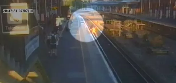 Harrowing footage has revealed the moment a teenager was rescued after trespassing on a railway
